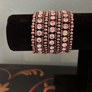 Bracelet rhinestone and silver color.